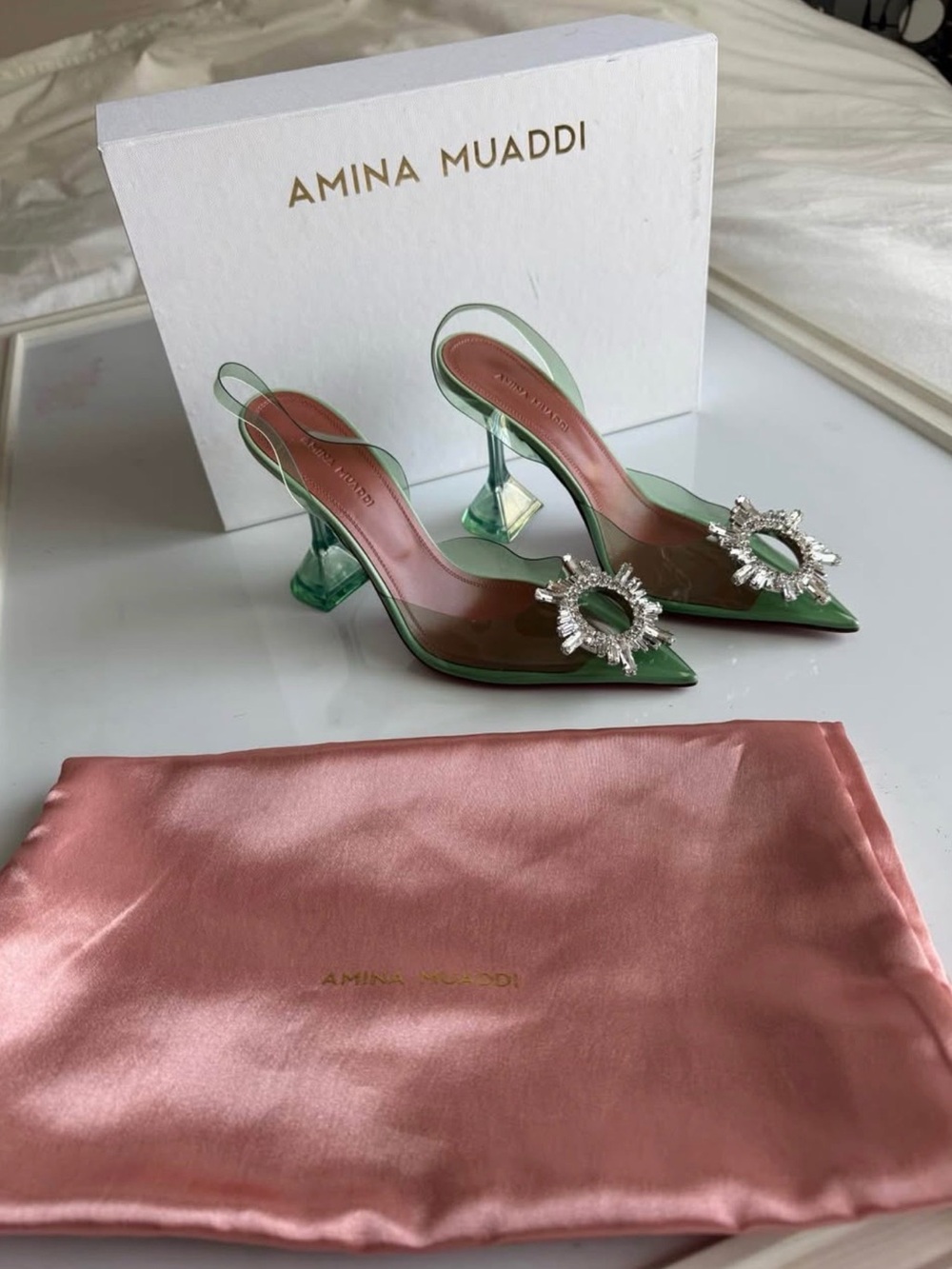 Amina Muaddi Green PVC Slingback Pumps with Crystal Sunburst Brooch